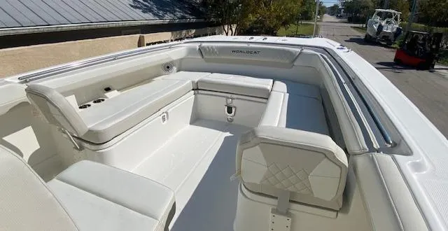 Slide: The Image of 2024 World Cat 280 CC-X boat interior with white seating and storage compartments. - 11