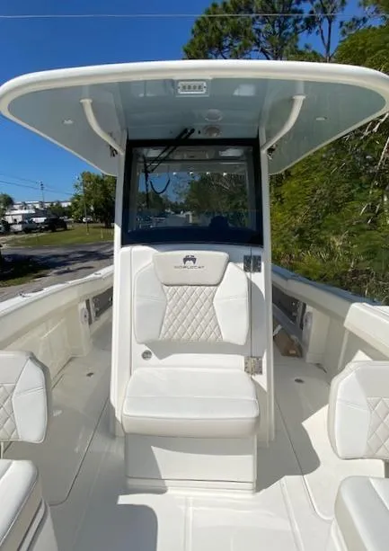 Slide: The Image of 2024 World Cat 280 CC-X boat interior with white seating and console. - 12
