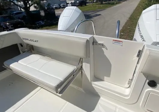 Slide: The Image of 2024 World Cat 280 CC-X boat with white seating and open side door. - 5