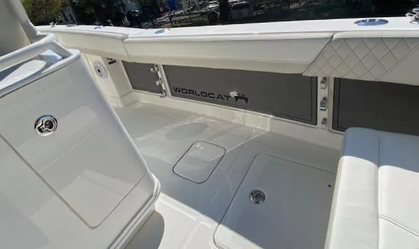 Slide: The Image of 2024 World Cat 280 CC-X boat interior with storage compartments and seating. - 6