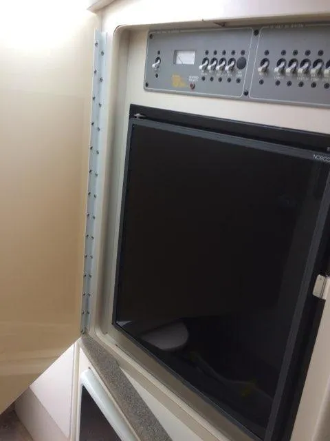 Slide: The Image of Electrical control panel and monitor inside a 2000 Formula 33SS boat. - 10