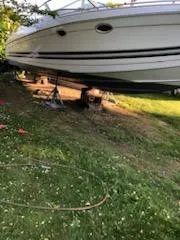 Slide: The Image of 2000 Formula 33SS boat on land, supported by stands. - 7