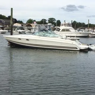 Slide: The Image of 2000 Formula 33SS boat docked in a marina with other boats. - 9