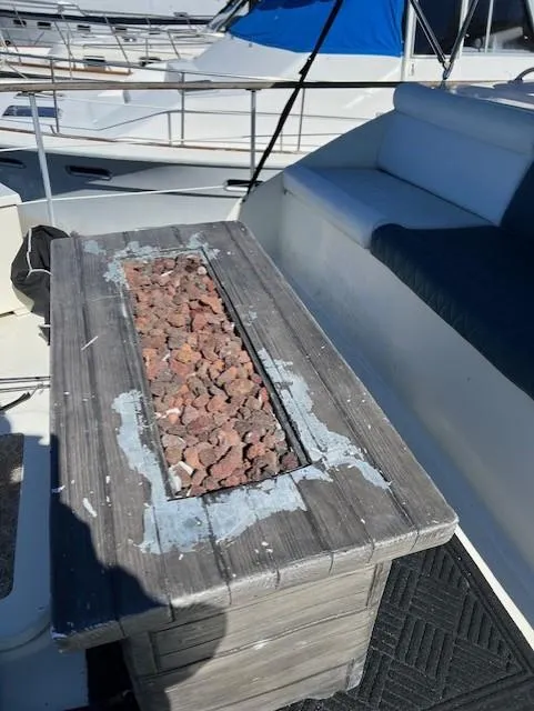 Slide: The Image of Weathered wooden table with stone inlay on a 1971 Hatteras 43 Double Cabin yacht deck. - 18