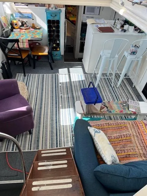 Slide: The Image of Interior of a 1971 Hatteras 43 Double Cabin with cozy seating and nautical decor. - 23