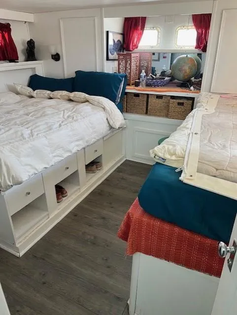 Slide: The Image of Interior of 1971 Hatteras 43 Double Cabin with cozy beds, storage, and nautical decor. - 29