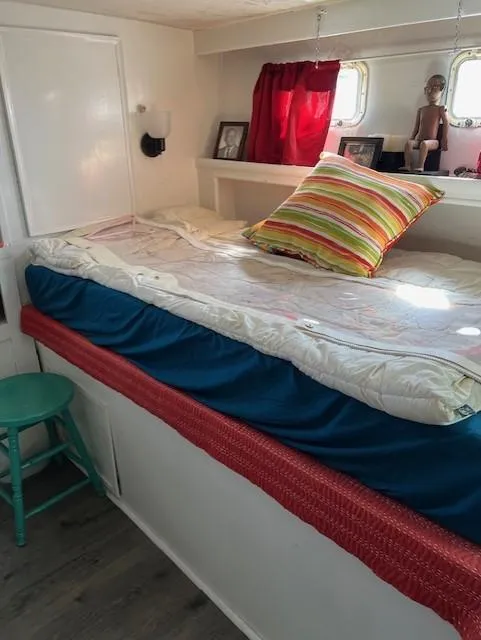 Slide: The Image of Cozy cabin interior of 1971 Hatteras 43 Double Cabin with colorful bedding and decor. - 30