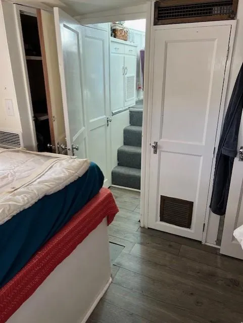 Slide: The Image of Interior of a 1971 Hatteras 43 Double Cabin with wood flooring and white cabinetry. - 31