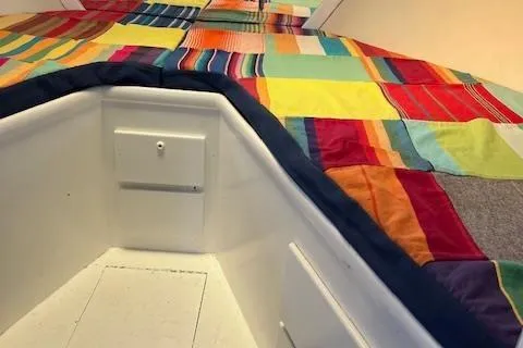Slide: The Image of Interior of 1971 Hatteras 43 Double Cabin with colorful patchwork quilt. - 36