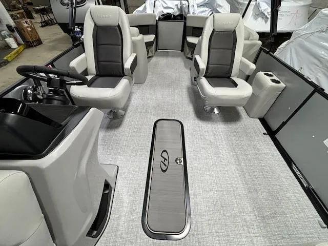 Slide: The Image of 2024 Harris Cruiser 210 CWDH interior with plush seating and modern design. - 10