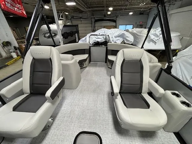 Slide: The Image of 2024 Harris Cruiser 210 CWDH pontoon boat interior with plush seating and modern design. - 12