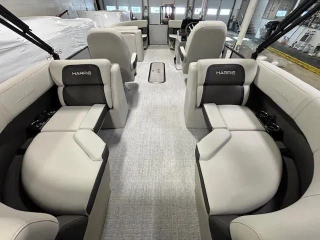 Slide: The Image of 2024 Harris Cruiser 210 CWDH boat interior with luxurious seating and modern design. - 16