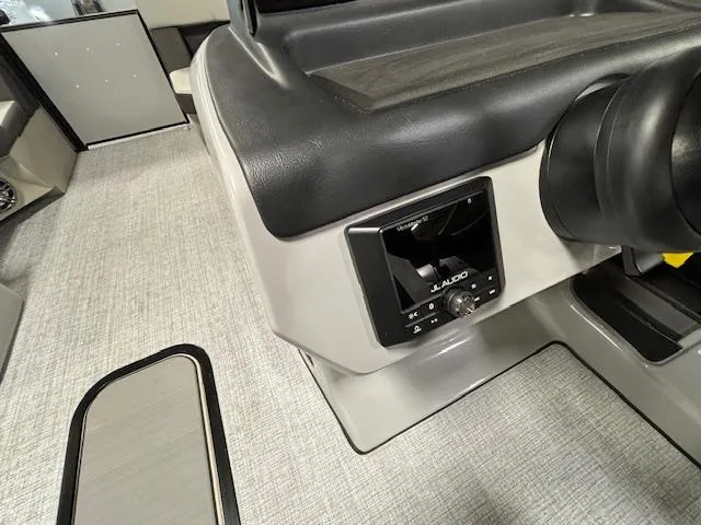 Slide: The Image of 2024 Harris Cruiser 210 CWDH boat interior with JL Audio system. - 22