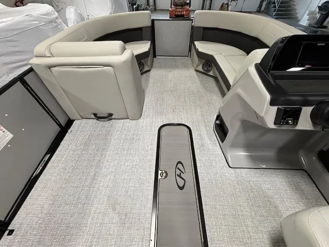 Slide: The Image of 2024 Harris Cruiser 210 CWDH pontoon boat interior with spacious seating and modern design. - 23