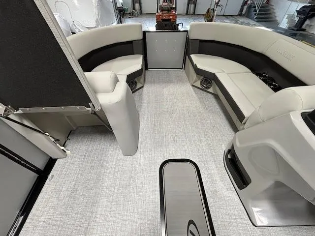 Slide: The Image of 2024 Harris Cruiser 210 CWDH interior with spacious seating and modern design. - 24