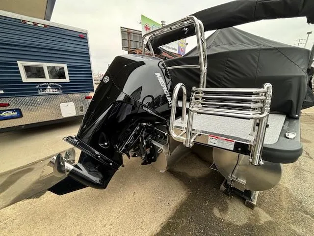 Slide: The Image of 2024 Harris Cruiser 210 CWDH pontoon boat with Mercury outboard motor. - 4