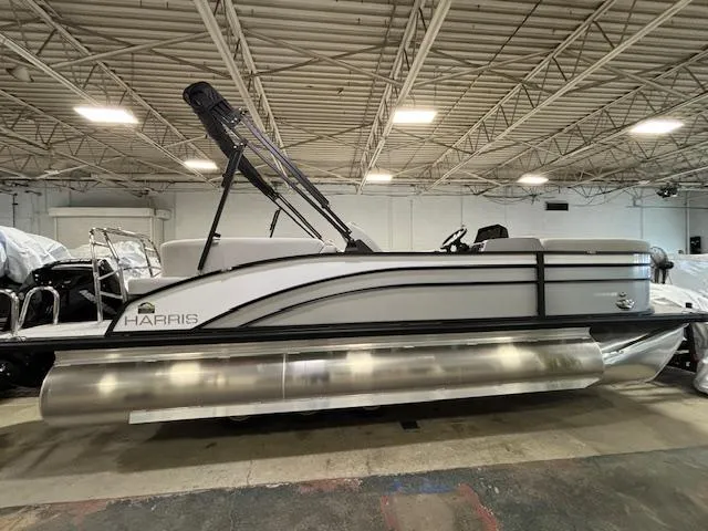 Slide: The Image of 2024 Harris Cruiser 210 CWDH pontoon boat in indoor storage facility. - 6