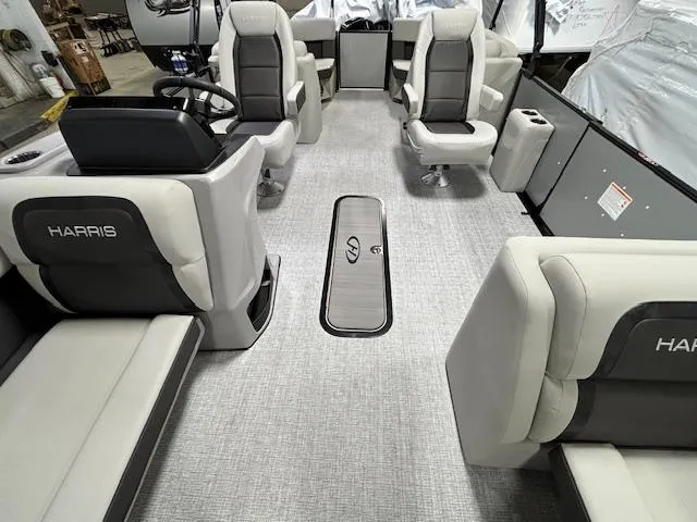 Slide: The Image of 2024 Harris Cruiser 210 CWDH interior with gray and black seating. - 9