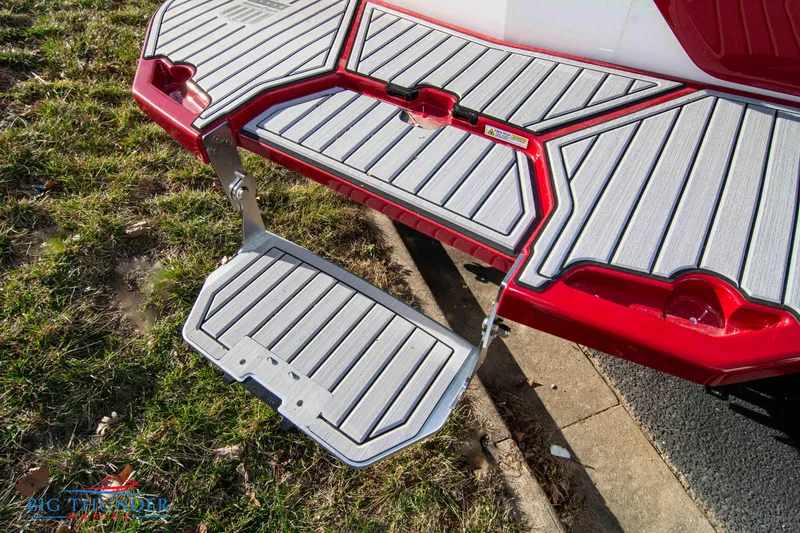 Slide: The Image of 2024 MasterCraft XT25 boat swim platform with fold-down step. - 10