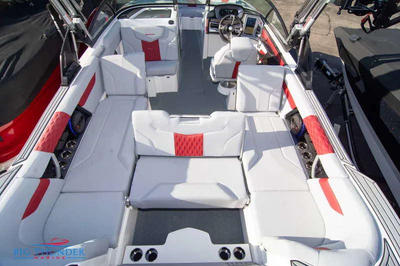 Slide: The Image of 2024 MasterCraft XT25 boat interior with white and red seating. - 15