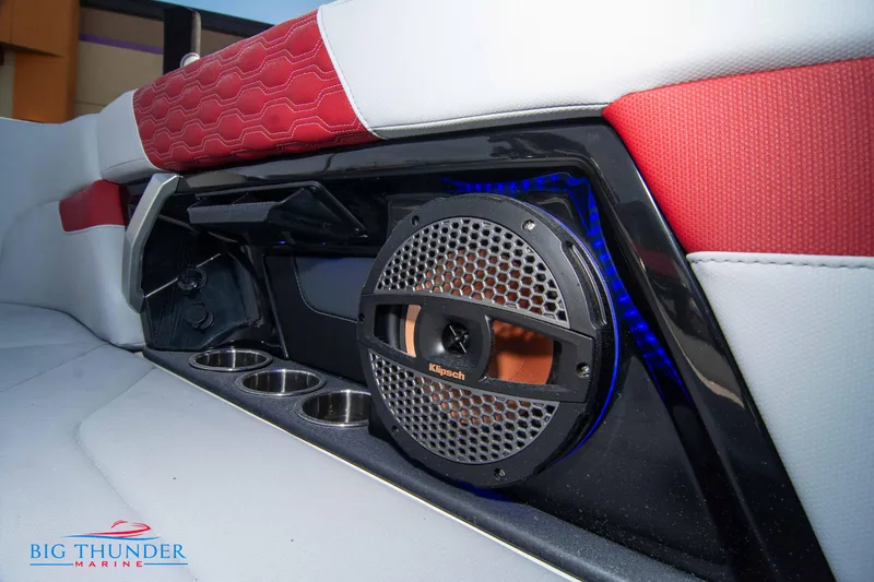 Slide: The Image of 2024 MasterCraft XT25 boat interior with speaker and cup holders. - 24