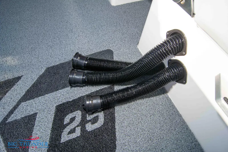 Slide: The Image of 2024 MasterCraft XT25 boat interior with flexible hoses and model branding. - 27