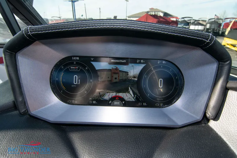 Slide: The Image of 2024 MasterCraft XT25 dashboard display with digital gauges and rearview camera. - 31