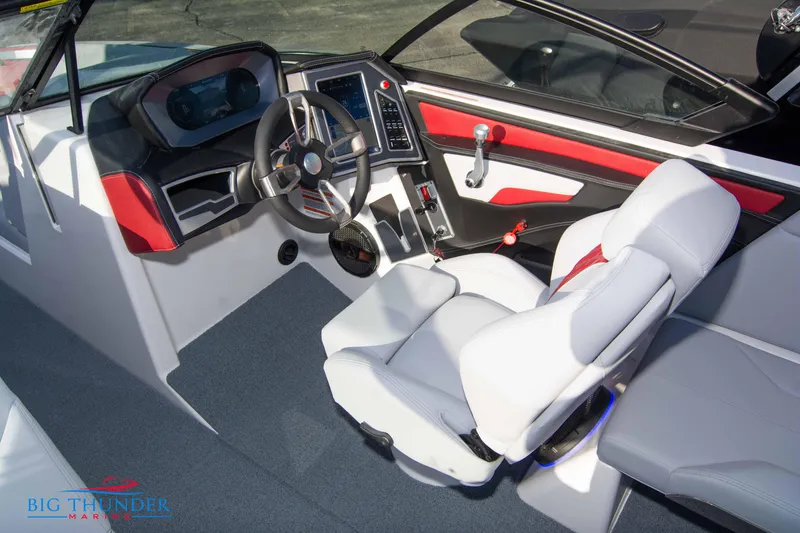 Slide: The Image of 2024 MasterCraft XT25 boat interior with modern dashboard and comfortable seating. - 35