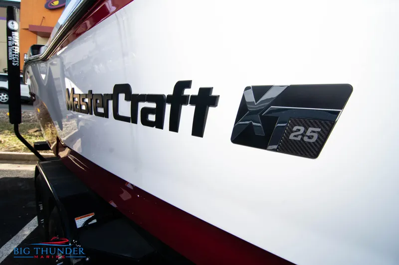 Slide: The Image of 2024 MasterCraft XT25 boat side view with logo and model name. - 4