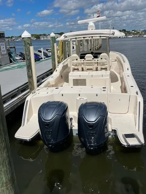 Slide: The Image of 2022 Grady-White Canyon 326 boat docked with twin outboard engines. - 5