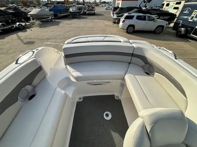 Slide: The Image of 2005 Chaparral 216 SUNSETTA boat interior with white and gray seating. - 14