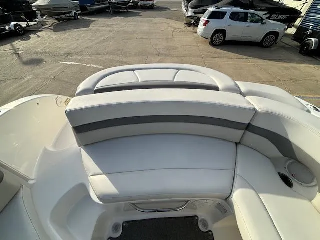 Slide: The Image of 2005 Chaparral 216 SUNSETTA boat interior with white and gray seating. - 15
