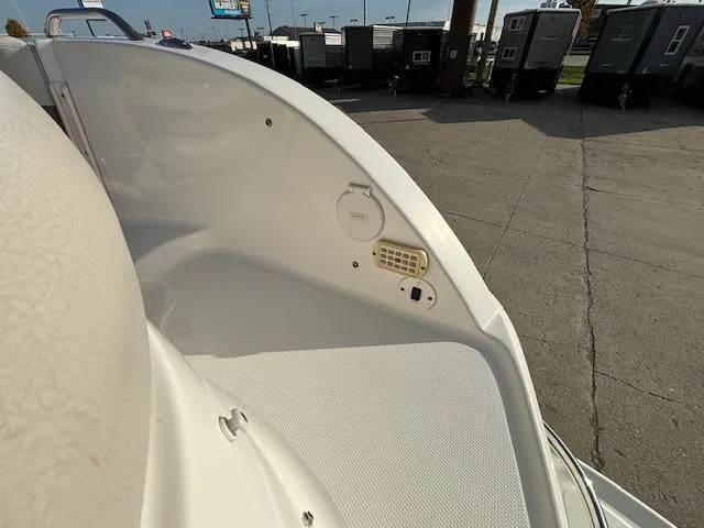 Slide: The Image of 2005 Chaparral 216 SUNSETTA boat interior, showing seating and speaker system. - 18