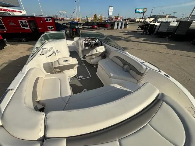 Slide: The Image of 2005 Chaparral 216 SUNSETTA boat interior with spacious seating and modern dashboard. - 19