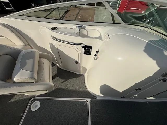 Slide: The Image of Interior of a 2005 Chaparral 216 SUNSETTA boat with seating and console. - 24