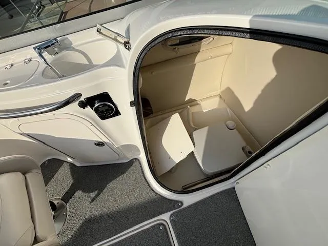 Slide: The Image of 2005 Chaparral 216 SUNSETTA boat interior with compact restroom. - 26