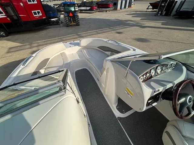 Slide: The Image of 2005 Chaparral 216 SUNSETTA boat interior with seating and dashboard. - 27