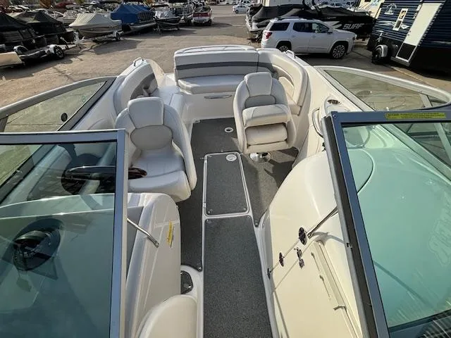 Slide: The Image of 2005 Chaparral 216 SUNSETTA boat interior with seating and open deck. - 9