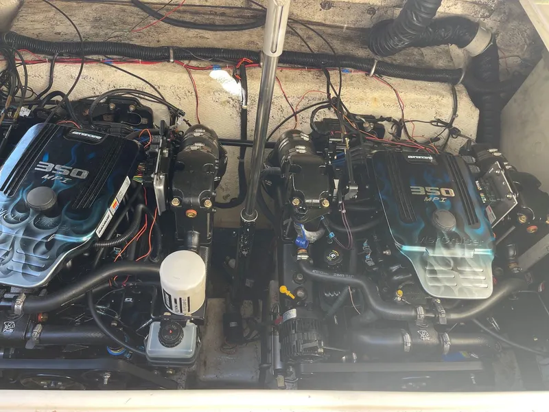 Slide: The Image of Twin engines of a 2001 Rinker 310 Fiesta Vee boat. - 10