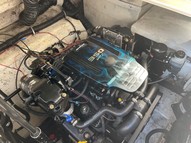 Slide: The Image of 2001 Rinker 310 Fiesta Vee engine compartment with 350 MAG MPI engine. - 11