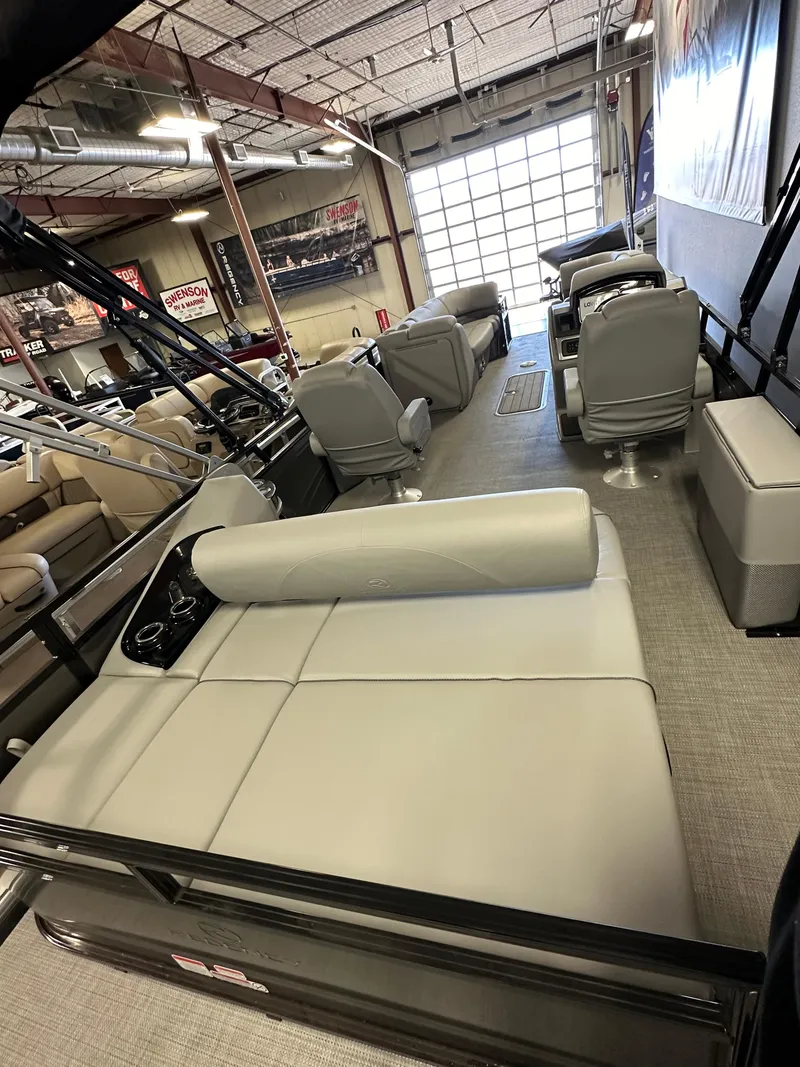 Slide: The Image of 2024 Regency 250 DL3 pontoon boat interior in showroom. - 3