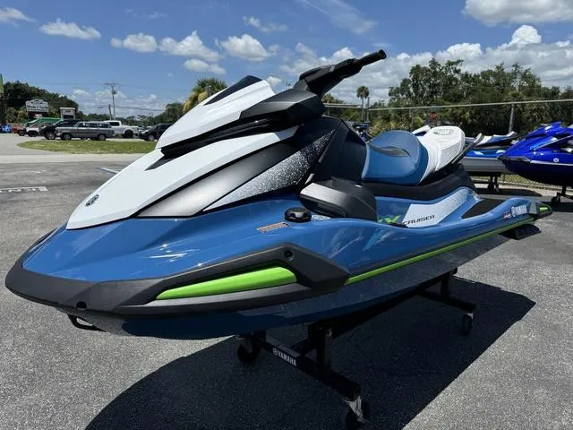 Slide: The Image of 2024 Yamaha Waverunners VX Cruiser® with Audio, blue and white jet ski on display. - 4