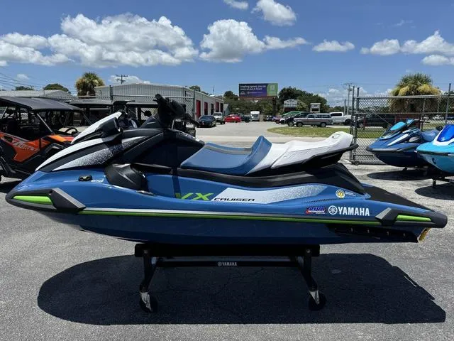 Slide: The Image of 2024 Yamaha Waverunner VX Cruiser with Audio, blue and green, parked outdoors. - 5