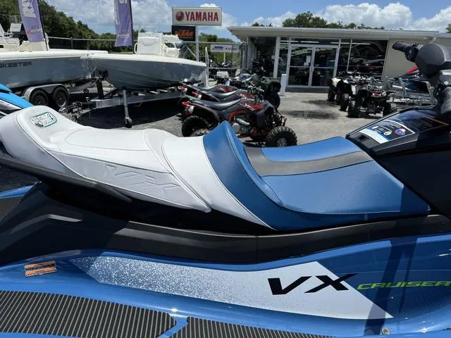 Slide: The Image of 2024 Yamaha Waverunner VX Cruiser with Audio, blue and white, at a dealership. - 8