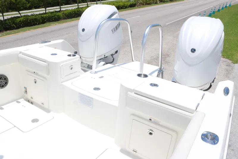 Slide: The Image of 2025 World Cat 235TE boat with dual Yamaha outboard engines, rear deck view. - 15