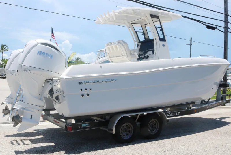 Slide: The Image of 2025 World Cat 235TE boat on a trailer with twin Yamaha engines. - 3
