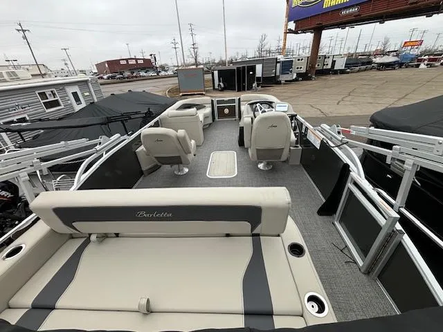Slide: The Image of 2024 Barletta ARIA 22UC pontoon boat interior at a dealership. - 14