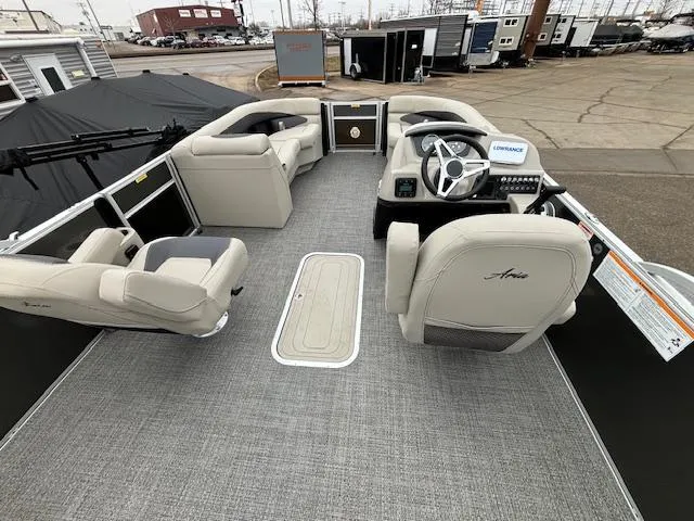 Slide: The Image of 2024 Barletta ARIA 22UC pontoon boat interior with helm, seating, and gray flooring. - 15