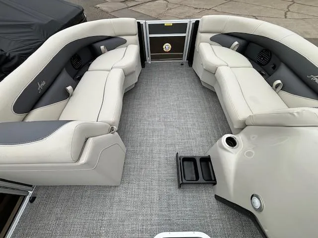 Slide: The Image of 2024 Barletta ARIA 22UC pontoon boat interior with plush seating and modern design. - 23