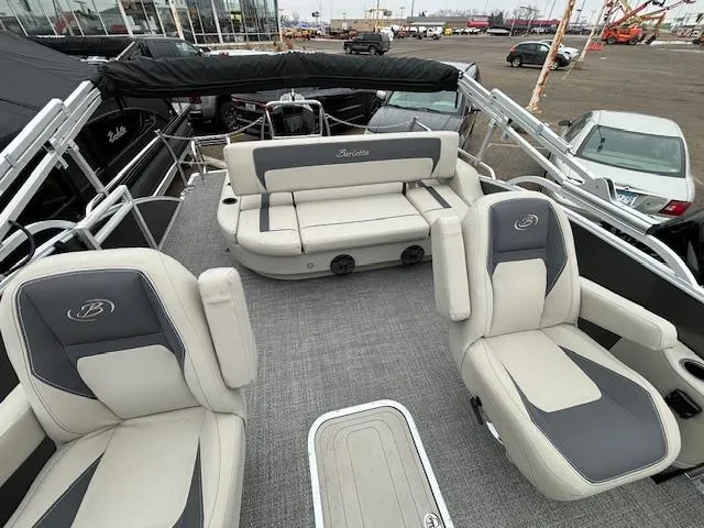 Slide: The Image of 2024 Barletta ARIA 22UC pontoon boat interior with plush seating and modern design. - 9